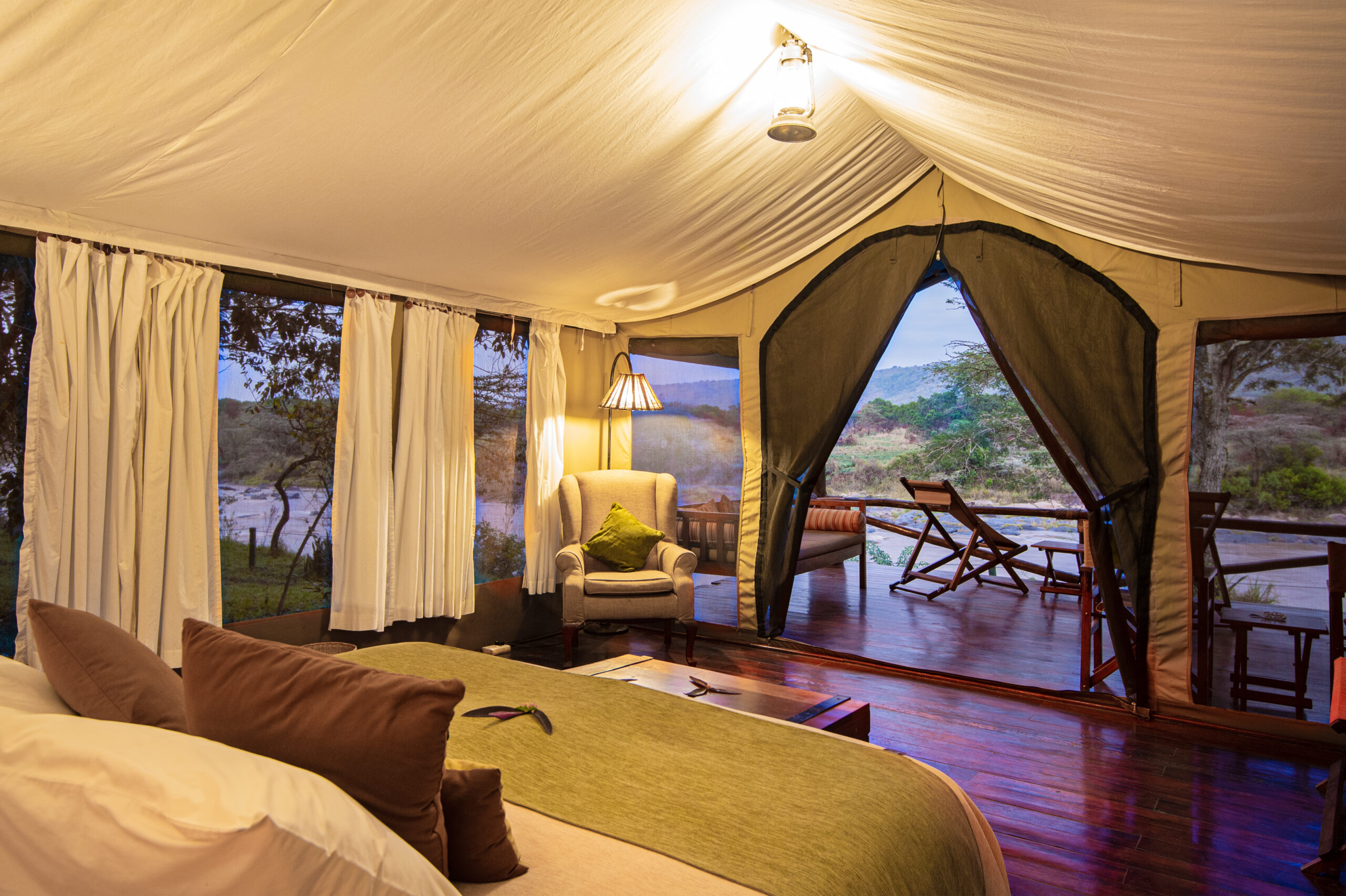 Luxury tented room at Karen Blixen Camp on the Mara River, Maasai Mara, on the Bush and Beach Safari Package by Air